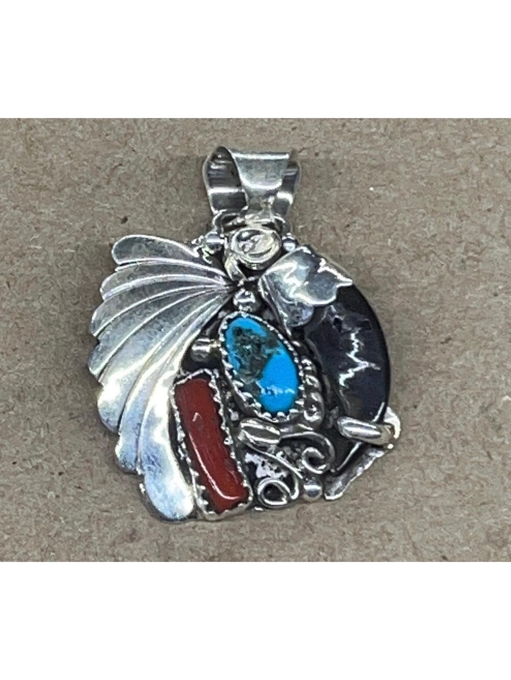 Native American Navajo handmade sterling silver badger turquoise coral pendant